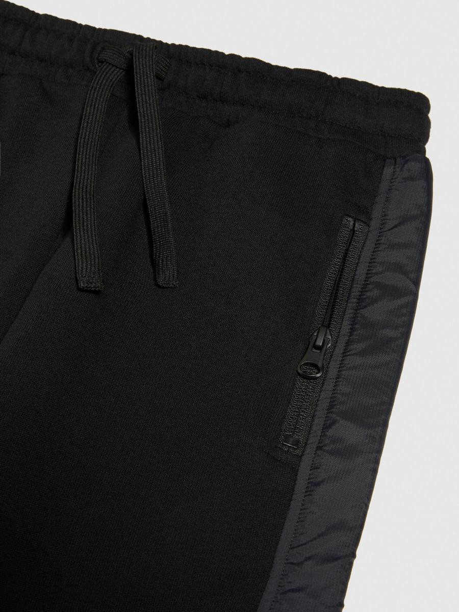 Sisley young dečija trenerka donji deo 